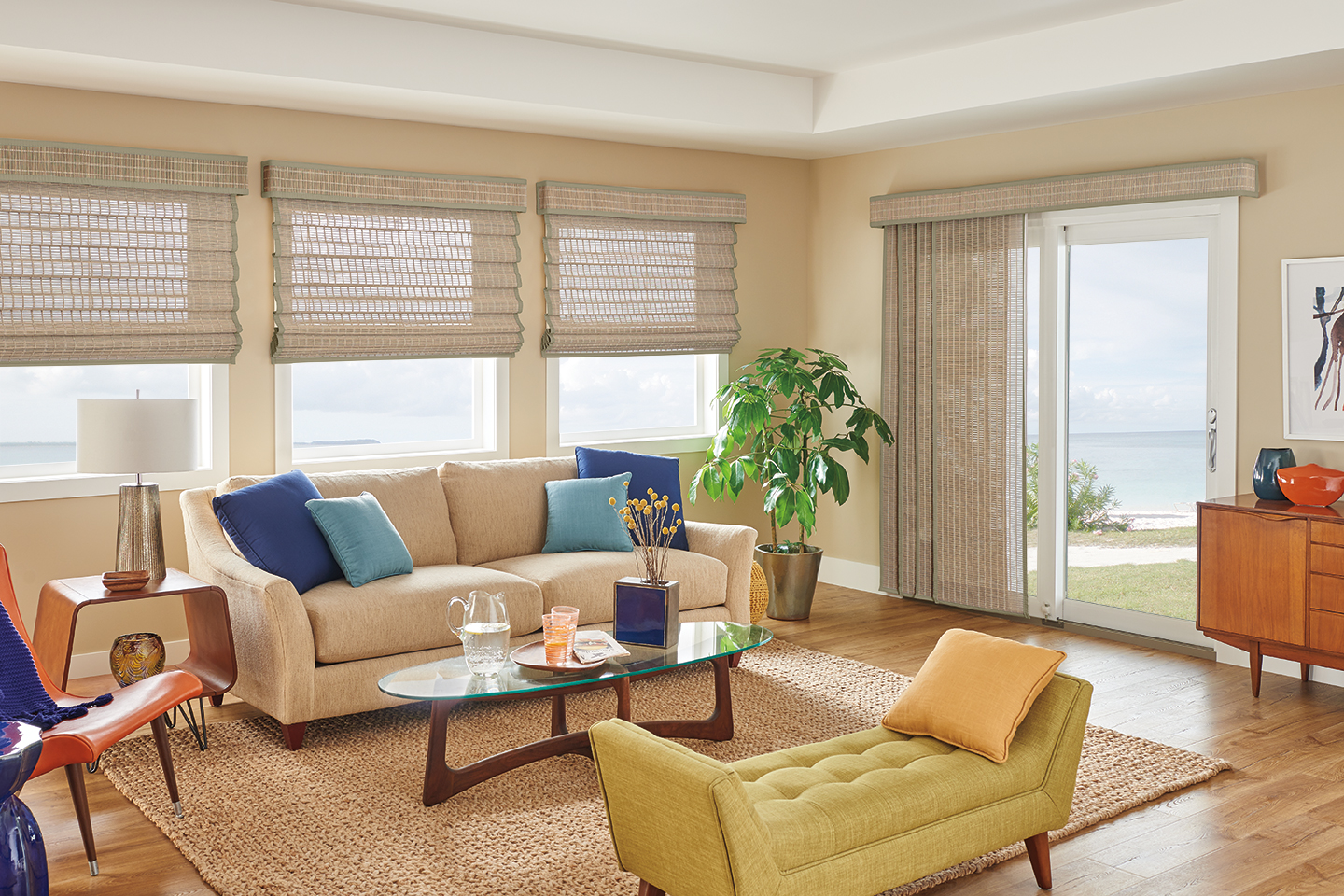 Sliding Panels with Wand Control: Spree, Studio T0745 with 1" Edge Banding: Light Sage 7173 and 6" Palisade Valance in Vertical Orientation with Valance-Only Privacy Liner: Sand 2701.
Standard Looped Roman Natural Shades with Cord Lift: Spree, Studio 80745 with 1" Edge Banding: Light Sage 7173 and 6" Palisade Valance in Vertical Orientation with Valance-Only Privacy Liner: Sand 2701